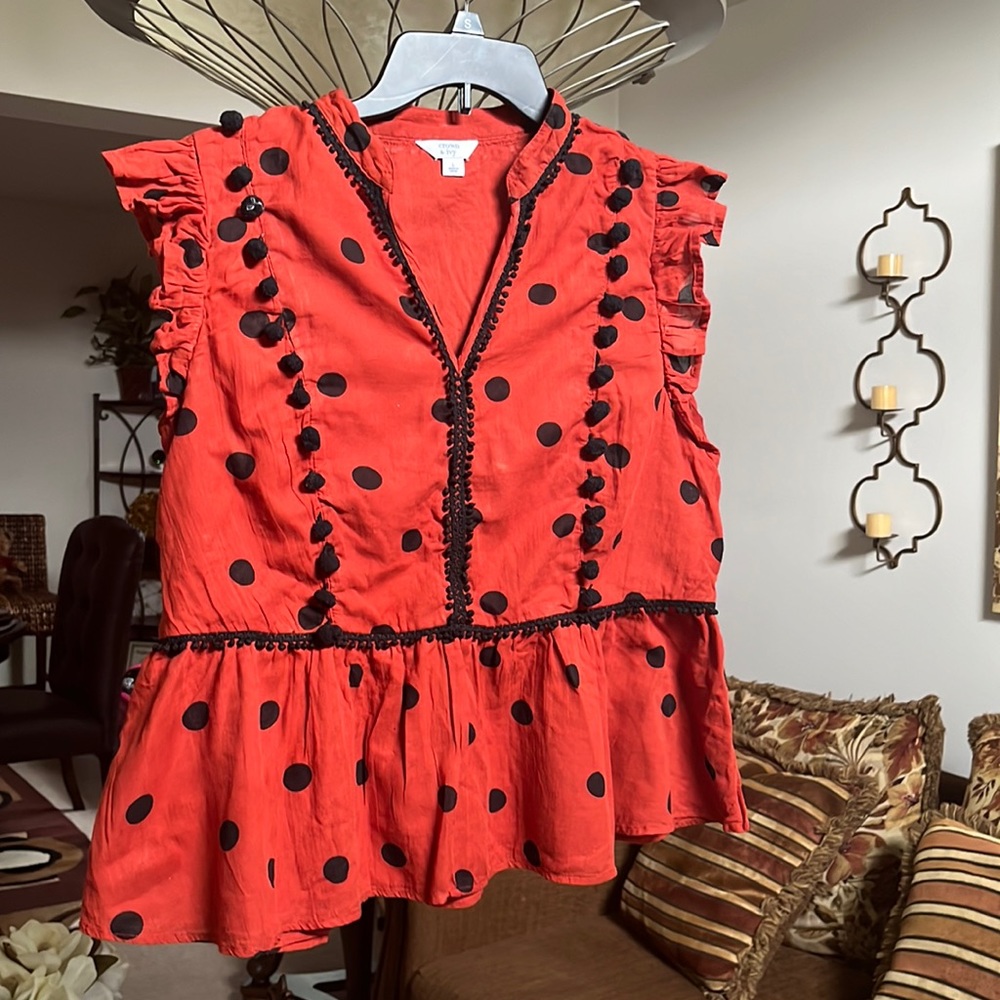 Women size L. Burnt orange and black polka dots.